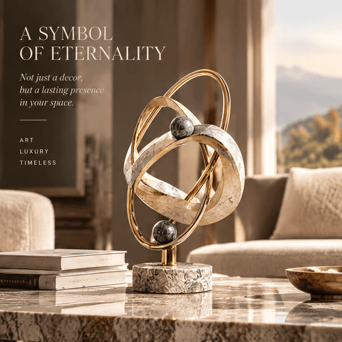 Eternal Trajectory sculpture – two wide cream travertine-veined marble rings at opposing orbital angles encircled by two slender gold brass wire rings with dark grey star-veined marble spheres at upper and lower intersections, on cylindrical grey travertine disc base, full product three-quarter view in bright classical arched gallery with warm dappled sunlight